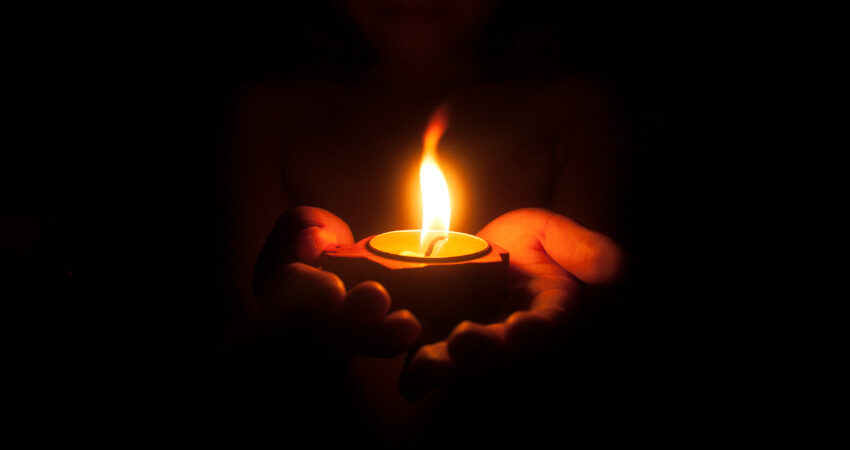 Régimen de Cuba culpa de los frecuentes y prolongados apagones en la isla al verano Little,Child,Holding,Burning,Candle,In,Darkness,With,Noise,And